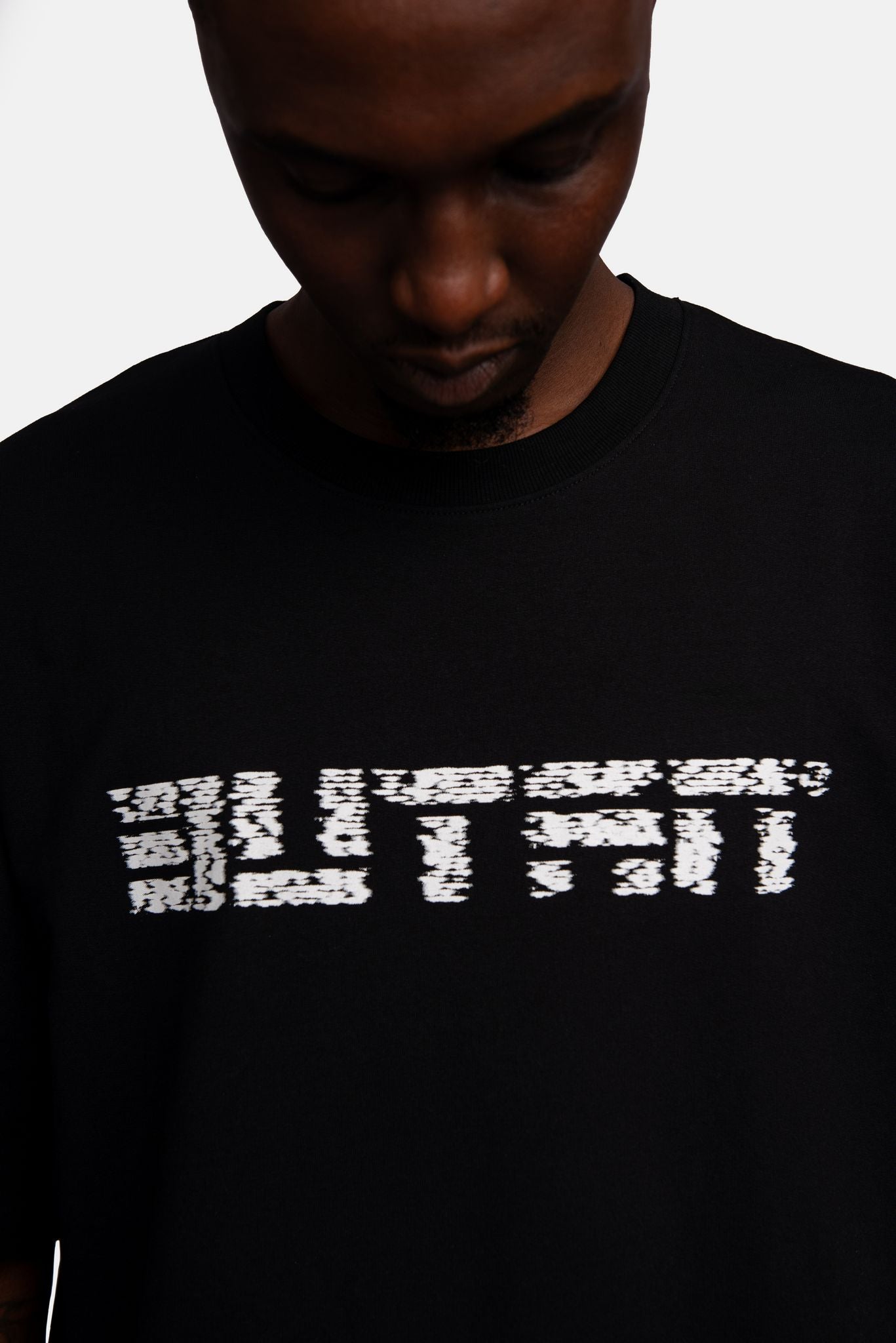 Butan Aluta Mask | White Noise | Oversized T-shirt in Black