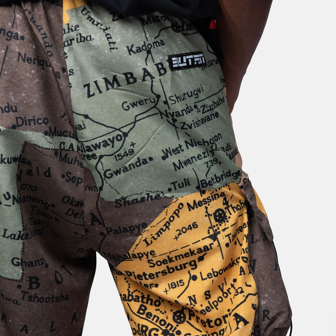 Map-themed shorts with 'Zimbabwe' text and 'ELITFON' branding on a plain background