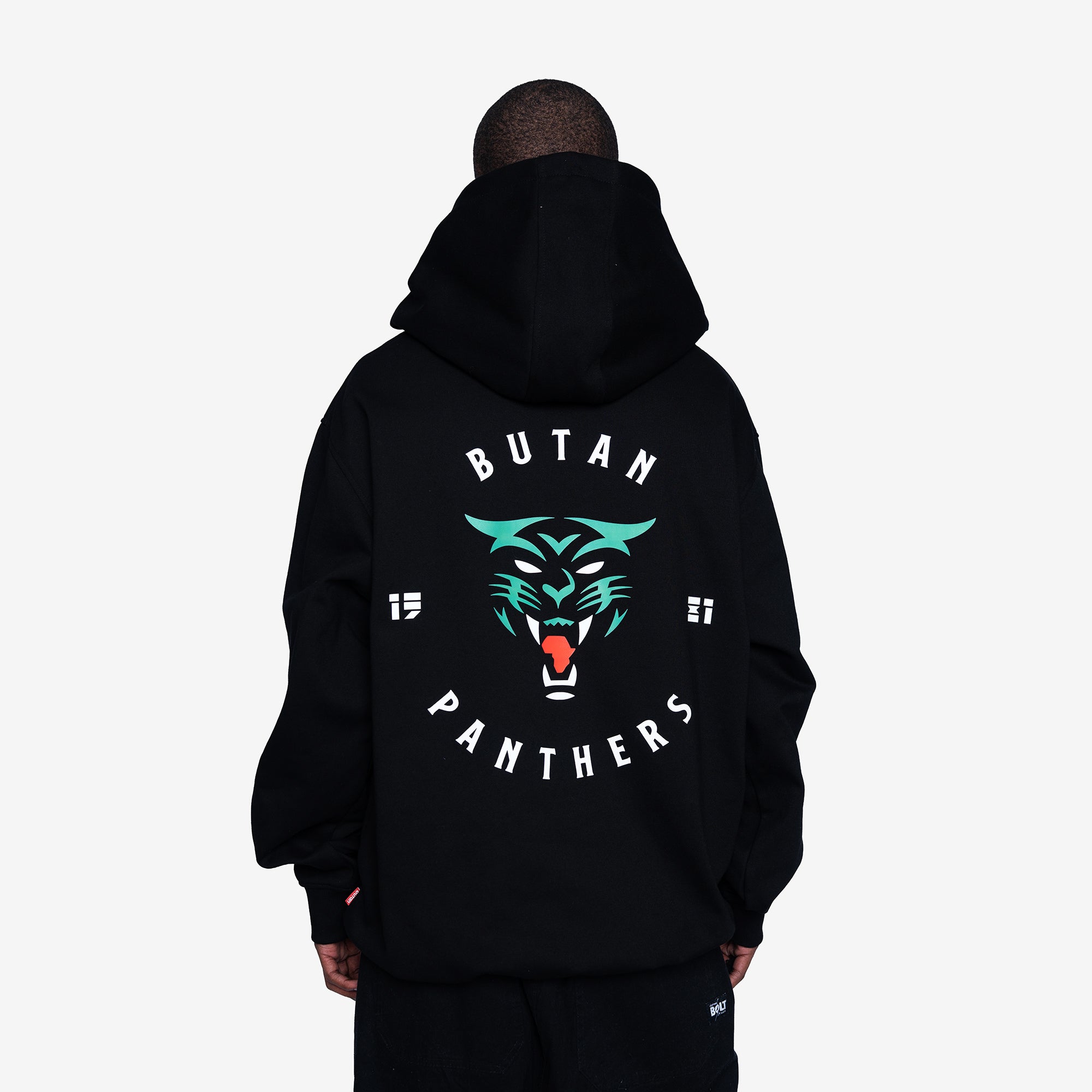 A person shown from the back wearing a black hoodie with a large graphic on the back. The design features a teal and red panther face with the words 'BUTAN PANTHERS' in white curved text.