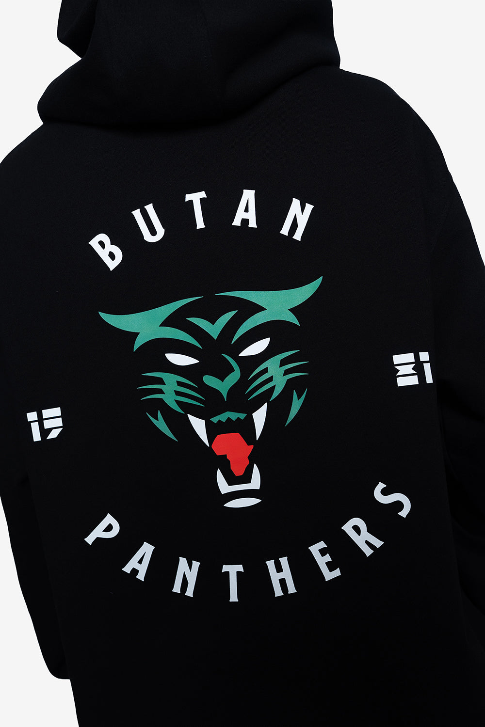 Close-up of the back of a black hoodie featuring a large graphic of a green and white panther face with a red tongue, surrounded by the text 'BUTAN PANTHERS' in white.