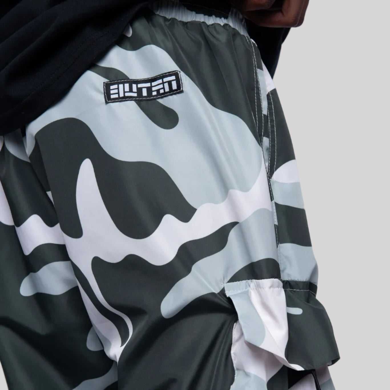 Camouflage jacket with brand logo on a white background