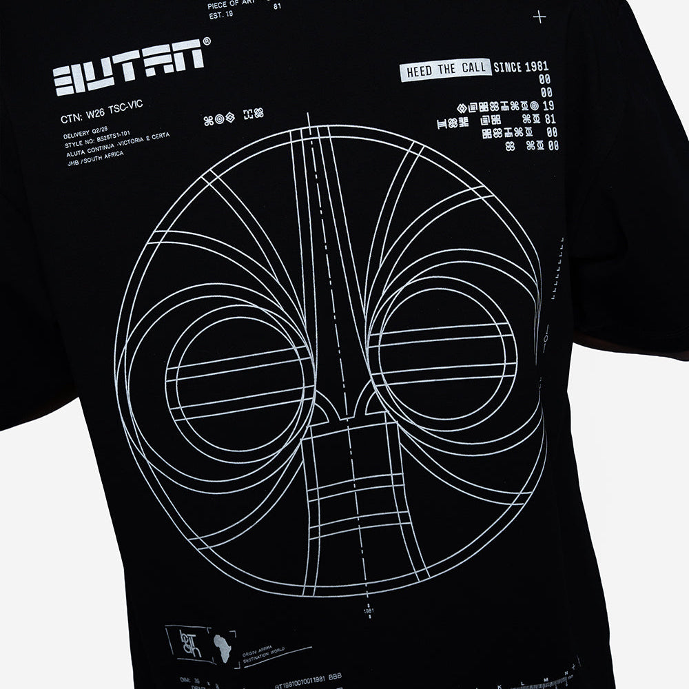 A black short-sleeve t-shirt with a white blueprint-style graphic of a helmet and technical text, worn by a model. The brand name 'BUTAN' is visible on the upper left.